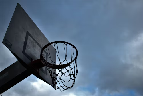 Basketball player dunking with proper jumping technique